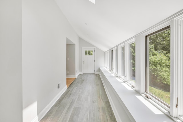 7 Topping Ln, Norwalk, CT 06854 - corridor featuring lofted ceiling, healthy amount of natural light, light wood finished floors, and baseboards