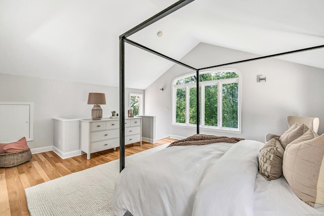 7 Topping Ln, Norwalk, CT 06854 - bedroom with lofted ceiling, wood finished floors, and baseboards