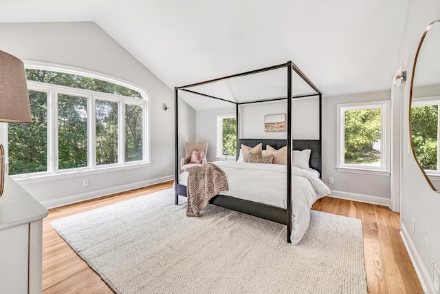 7 Topping Ln, Norwalk, CT 06854 - bedroom with lofted ceiling, light wood-type flooring, and baseboards
