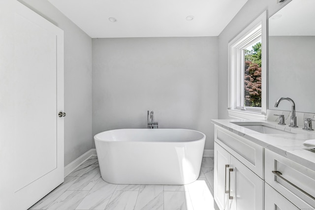 7 Topping Ln, Norwalk, CT 06854 - bathroom featuring a soaking tub, marble look tiles, vanity, baseboards, and recessed lighting
