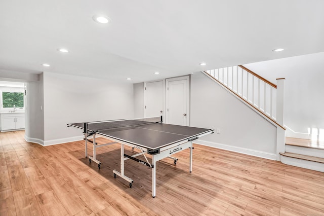 7 Topping Ln, Norwalk, CT 06854 - recreation room featuring light wood-style floors, recessed lighting, a sink, and baseboards