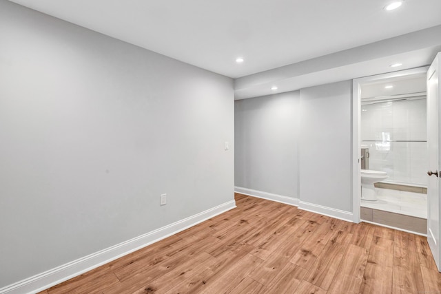 7 Topping Ln, Norwalk, CT 06854 - unfurnished bedroom featuring recessed lighting, light wood-type flooring, baseboards, and connected bathroom