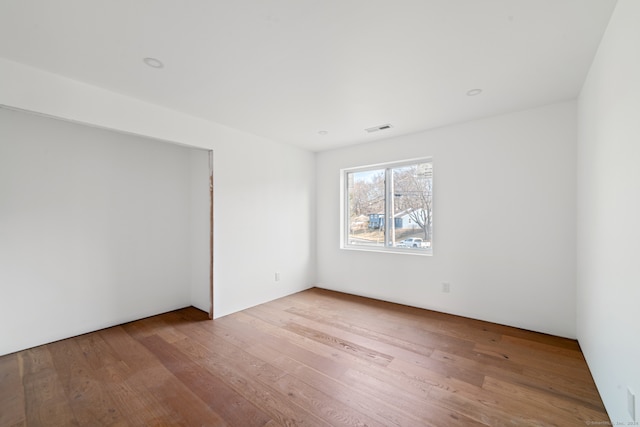 spare room featuring light hardwood / wood-style flooring