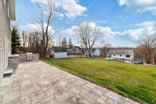 view of yard with an outdoor structure and a patio