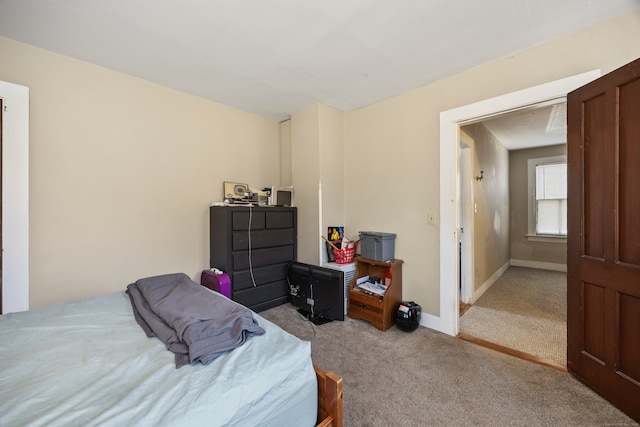 bedroom featuring light carpet