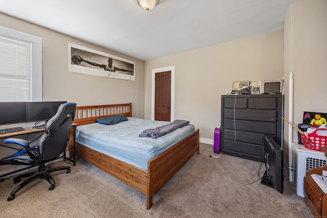 bedroom with light colored carpet