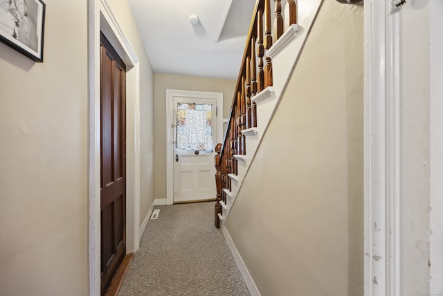 entryway featuring carpet flooring