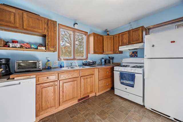 kitchen with white appliances and sink