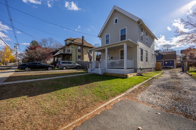 view of front facade with a porch and a front lawn