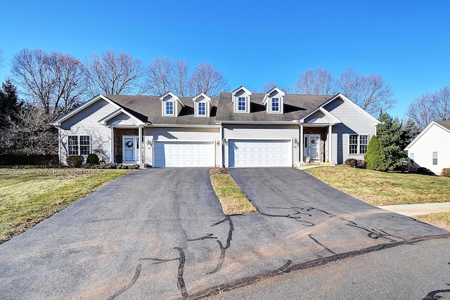 view of front facade with a garage and a front lawn