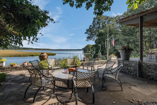 view of patio featuring a water view