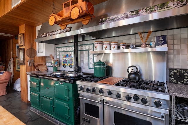 kitchen featuring wood walls and double oven range