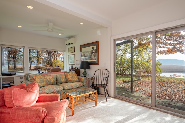 sunroom / solarium with a wall unit AC, ceiling fan, and a water view