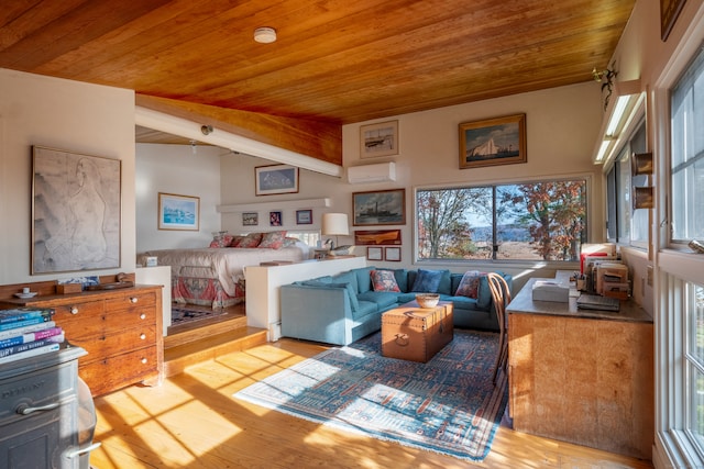 interior space featuring multiple windows, light hardwood / wood-style flooring, and vaulted ceiling