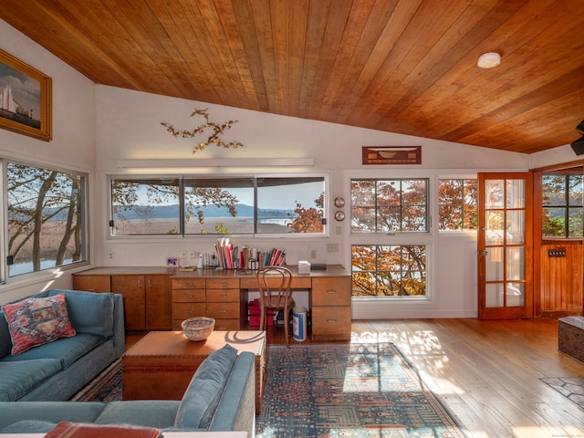 sunroom / solarium featuring wooden ceiling and vaulted ceiling