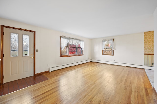 entryway featuring baseboard heating and light wood-type flooring