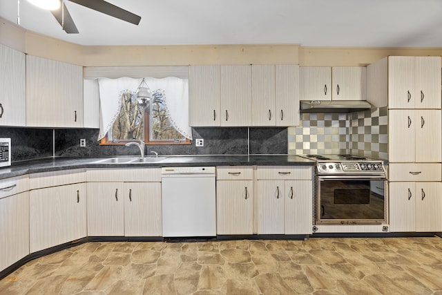 kitchen with decorative backsplash, appliances with stainless steel finishes, sink, and ceiling fan