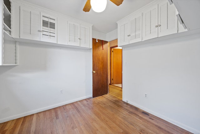 empty room featuring light hardwood / wood-style flooring and ceiling fan