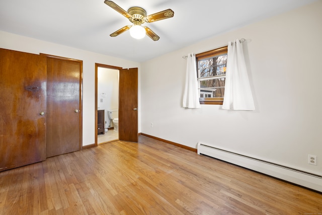 unfurnished bedroom with ensuite bathroom, ceiling fan, light hardwood / wood-style flooring, a baseboard heating unit, and a closet