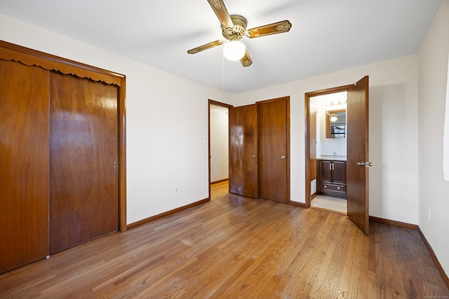 unfurnished bedroom featuring ensuite bathroom, ceiling fan, and light hardwood / wood-style floors