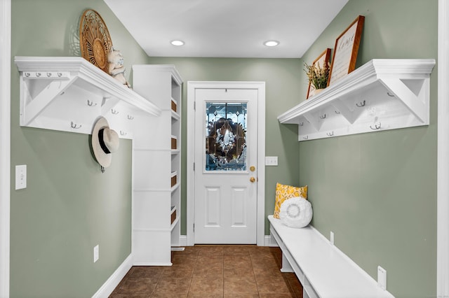 mudroom featuring dark tile patterned floors