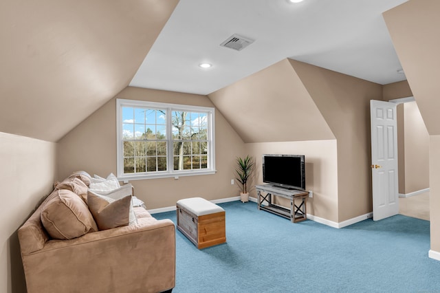 carpeted living room featuring lofted ceiling