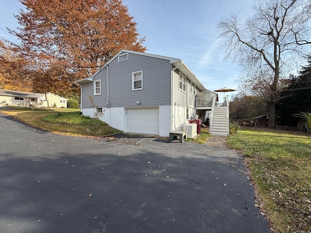 view of property exterior with a garage