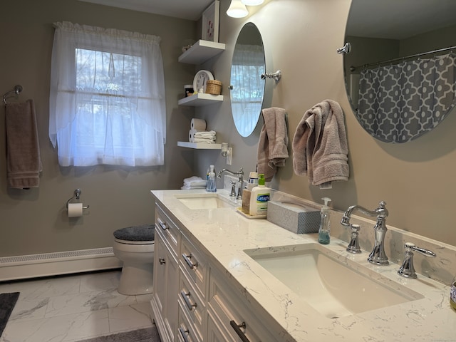 bathroom featuring toilet, vanity, curtained shower, and a baseboard radiator