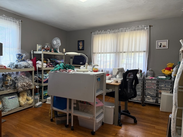 home office with dark hardwood / wood-style floors