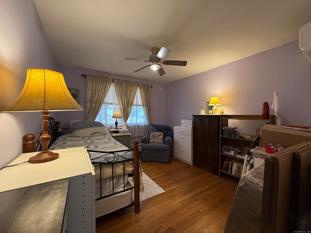 bedroom featuring hardwood / wood-style floors and ceiling fan