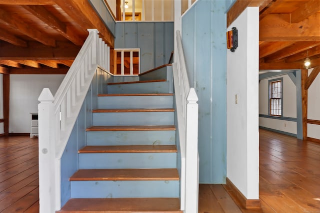 staircase with wood-type flooring