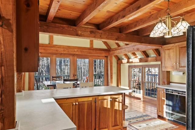 kitchen featuring wooden ceiling, lofted ceiling with beams, decorative light fixtures, light wood-type flooring, and french doors