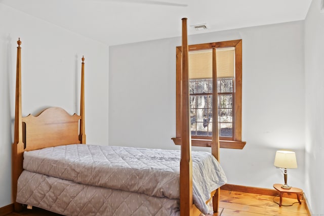 bedroom featuring hardwood / wood-style floors