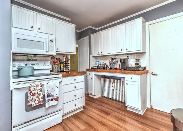 kitchen featuring white cabinetry, white appliances, light hardwood / wood-style flooring, crown molding, and butcher block countertops