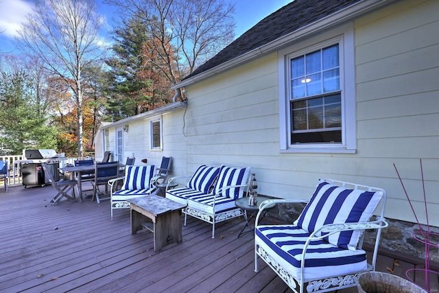 wooden deck featuring grilling area