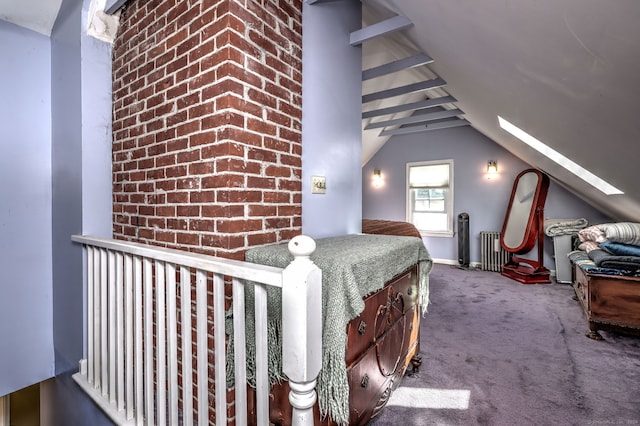 carpeted bedroom featuring radiator and lofted ceiling