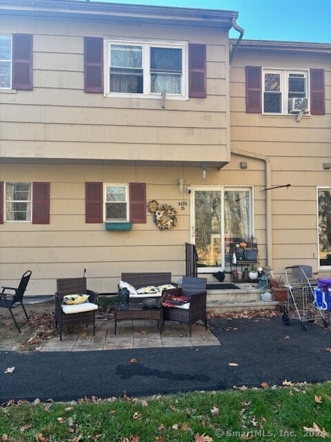 rear view of property with a patio area