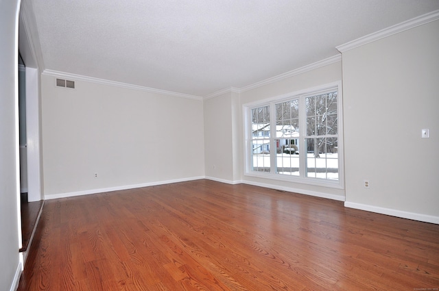 unfurnished room featuring ornamental molding and hardwood / wood-style floors