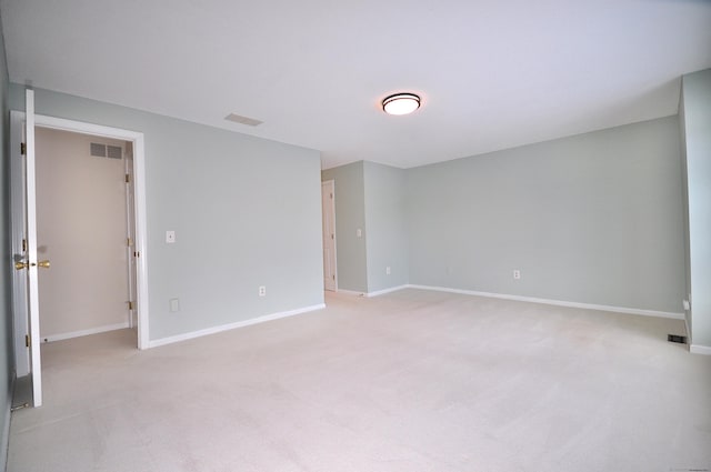 unfurnished room with light carpet