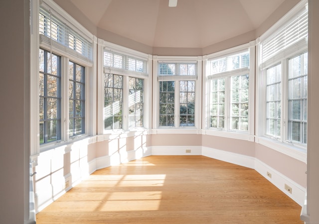 unfurnished sunroom with a wealth of natural light and vaulted ceiling