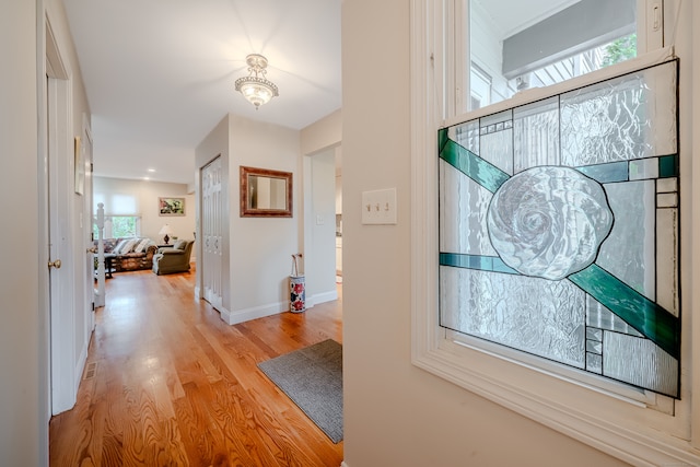 corridor featuring light hardwood / wood-style floors