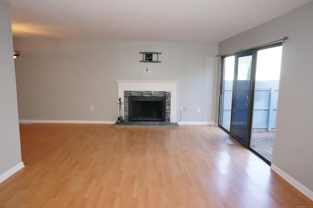 unfurnished living room featuring hardwood / wood-style flooring