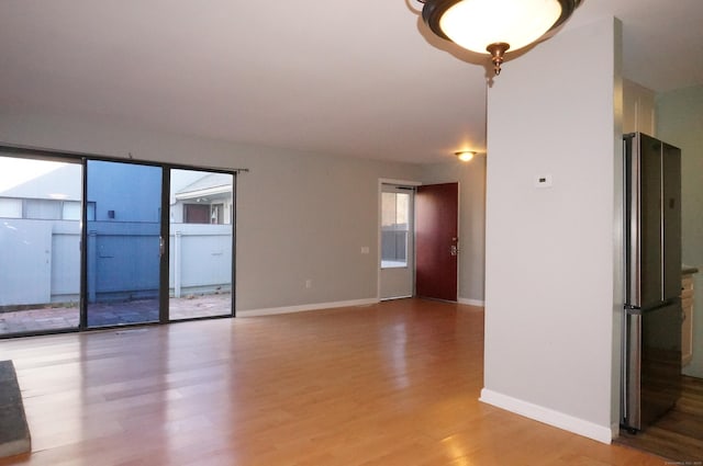 unfurnished room featuring light hardwood / wood-style flooring