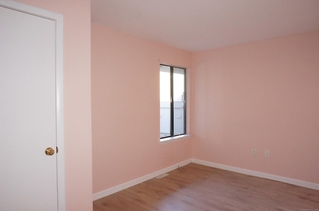 unfurnished room featuring light wood-type flooring