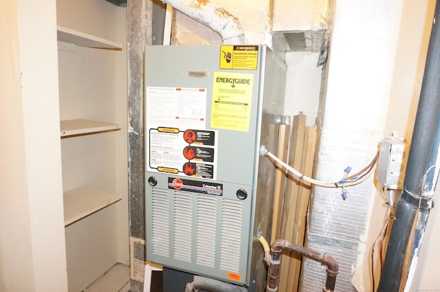 utility room featuring heating unit