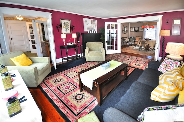 living room featuring ornamental molding, french doors, and dark hardwood / wood-style floors