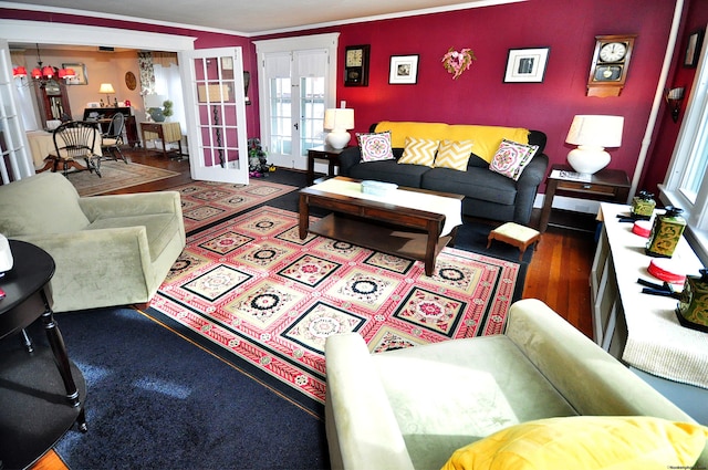 living room with french doors and crown molding