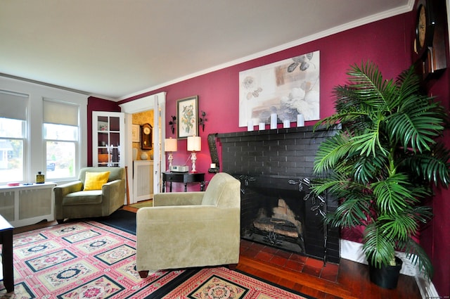 living room featuring ornamental molding and hardwood / wood-style flooring