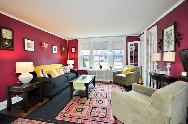 living room with hardwood / wood-style floors and crown molding