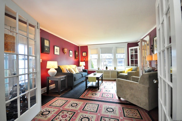 living room with crown molding and french doors